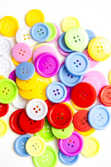 Fototapeta na wymiar Bright assorted buttons, mix colors