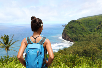 Hawaii travel nature hiker girl hiking in Pololu valley enjoying lookout view of mountains. Big...