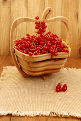 red currant on the wooden vase