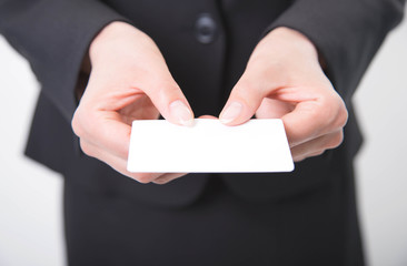 Business woman giving white business card