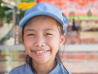 Beautiful asian kid happy smiling  in the park.