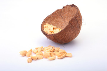 Roasted peeled peanuts in Handmade bowl of coconut, Selective Focus