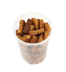 Plastic box filled with bread croutons