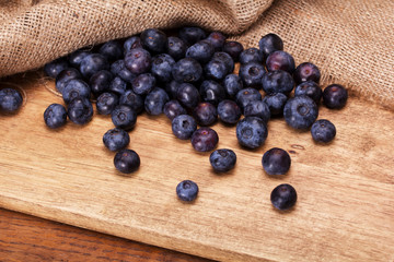 Split blueberries on a rustic wooden background
