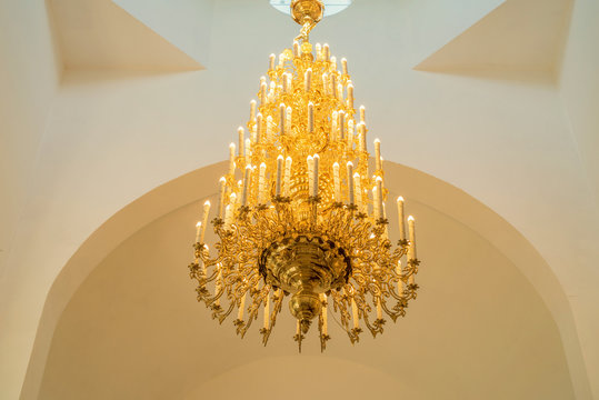 Magnificent baroque chandelier on the ceiling