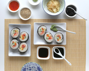Sushi rolls with sesam, soy sauce, caviar, wasabi and ginger
