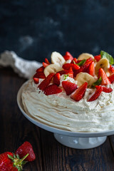 pavlova, meringue cake with strawberries and bananas