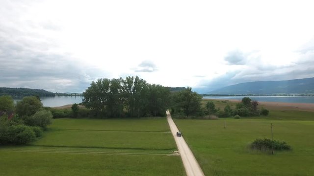 From High - flying up over  fieds and following car -  St.Peters Island