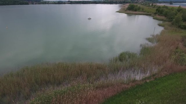 From shore to boat - flying up over lake and fieds - St.Peters Island