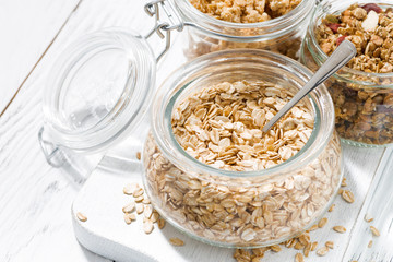 oat flakes and assortment of muesli, closeup top view