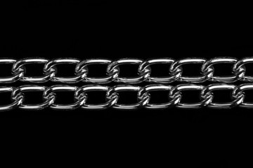 Chain heap - abstract metal background. Collection silver jewelry chains on an isolated black...