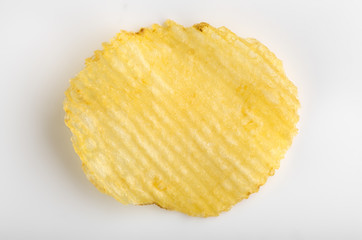 Crispy potato chips. Fast Food. Potatoes. Fatty unhealthy foods. corrugated chips