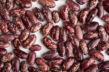 Dark Spotted kidney bean isolated on white background. Dark kidney bean texture background. A large bean with a subtle sweet flavor and soft texture. Beans. Proper nutrition. Vitamins. Healthy food.