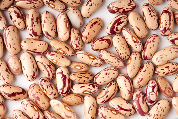 Light spotted kidney bean isolated on white background. Light kidney bean texture background. A large bean with a subtle sweet flavor and soft texture. Beans. Proper nutrition. Vitamins. Healthy food.