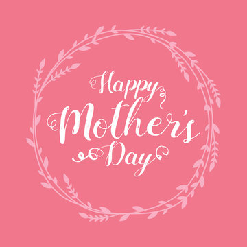 Happy Mothers Day lettering. Handmade calligraphy vector illustration with hand drawn floral wreath. White text on pink background.