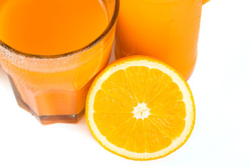 Orange juice. Isolated drink. A glass of orange juice and pieces of orange fruit isolated on white background. Citrus. Diet. Vitamins. Healthy food.