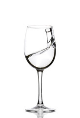 A splash of crystal clear water in a glass for wine. Water splashes. Drinking water. Alcohol.
