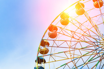 A colourful ferris wheel. Attractions. Amusement park. Children's entertainment. Multicolored...