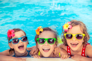 Happy children in the swimming pool