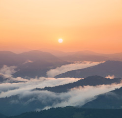 Obraz premium Mountain valley during sunrise. Natural summer landscape