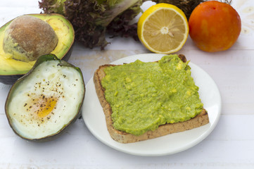 Healthy food. Vegan sandwiches with fresh avocado on wooden background.
