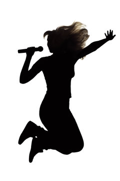 Silhouette of a woman jumping with a microphone up