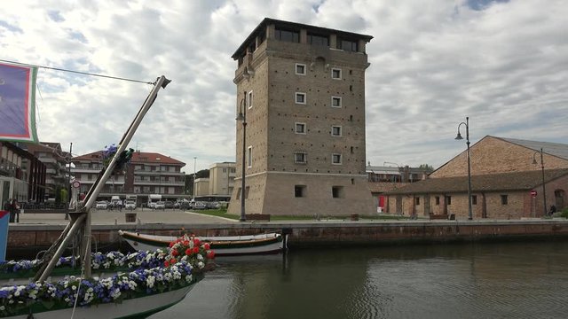 ancient tower overlooking tourist harbor