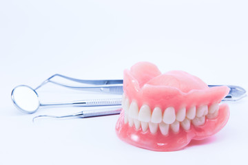 teeth and dental mirror, symbol photo of dentures, diagnosis and copayment