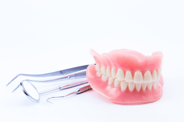 teeth and dental mirror, symbol photo of dentures, diagnosis and copayment