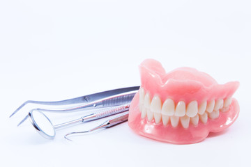 teeth and dental mirror, symbol photo of dentures, diagnosis and copayment