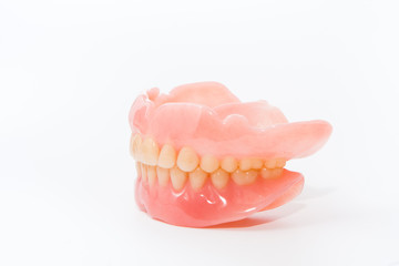 complte denture on white background