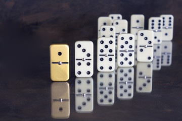 Business concept - Unique domino standing out from the rest - background with text space