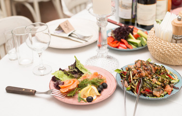 Festive table with snacks and flowers