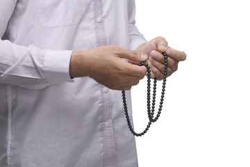 Hand of muslim man with prayer beads pray to god