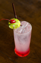 Strawberry cocktail with ice on wood table