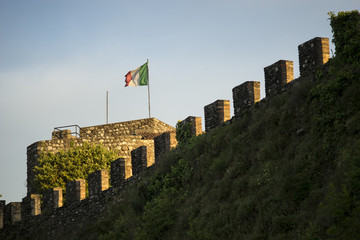 Italian flag on the ancient castle