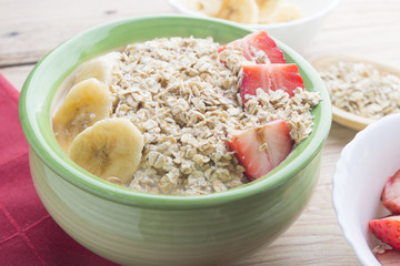 Bowl oats ingredients (oat, banana, strawberry and vegetal milk)
