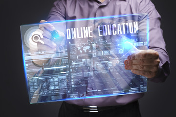 Business, Technology, Internet and network concept. Young businessman working on a virtual screen of the future and sees the inscription: Online education