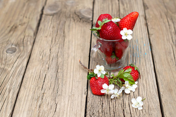 Fresh strawberries on old wooden table  