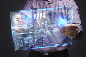 Business, Technology, Internet and network concept. Young businessman working on a virtual screen of the future and sees the inscription: APPS