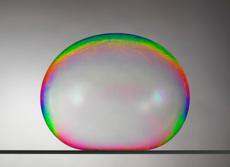 Still life of large bubble on flat surface