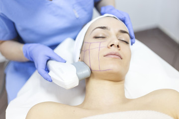 Cosmetic treatments for the skin in the beauty salon. Woman in spa salon