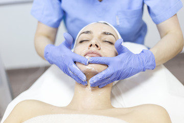 Cosmetic treatments for the skin in the beauty salon. Woman in spa salon