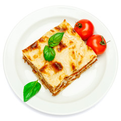 Portion of tasty lasagna isolated on white