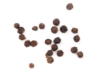 Black peppercorn isolated on white background. Top view