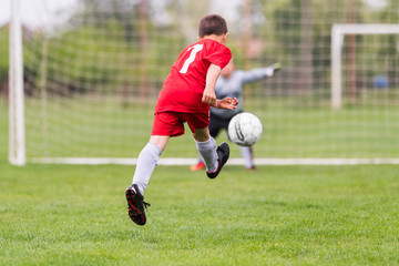 Kids soccer football - children players match on soccer field