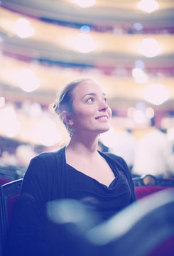 Woman In Auditorium Of Teatre