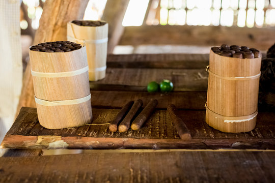 Three packages of hand made cuban cigars on workbench, Vinales, Cuba