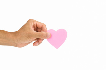 Man's hand holding pink heart on white background