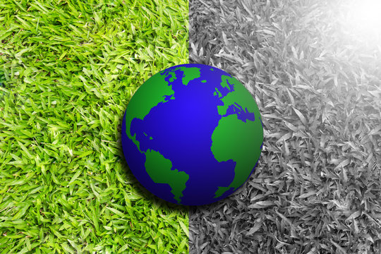 Earth on half green and half black and white grass, environment concept